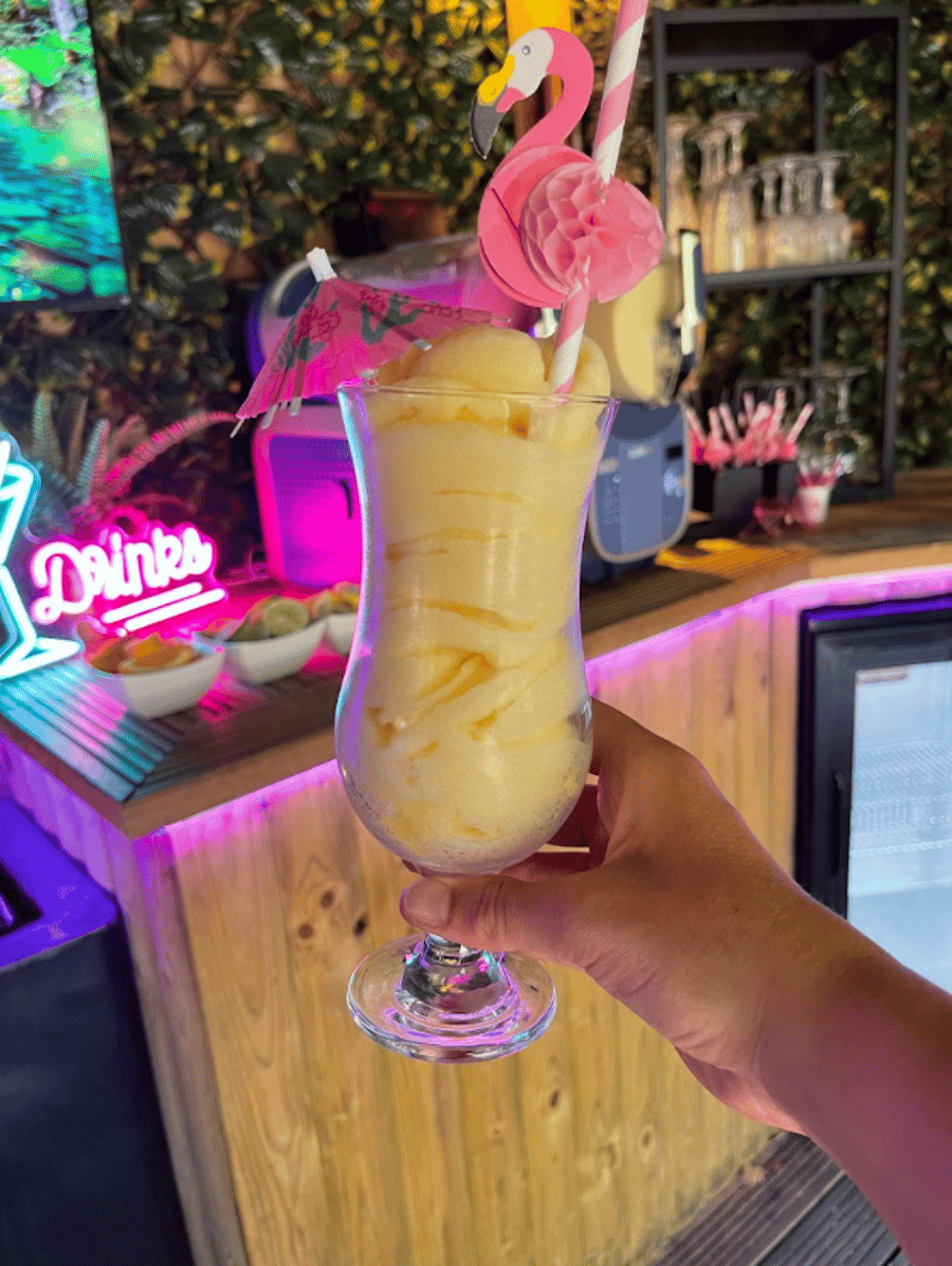 Frozen cocktail with flamingo decoration and straw